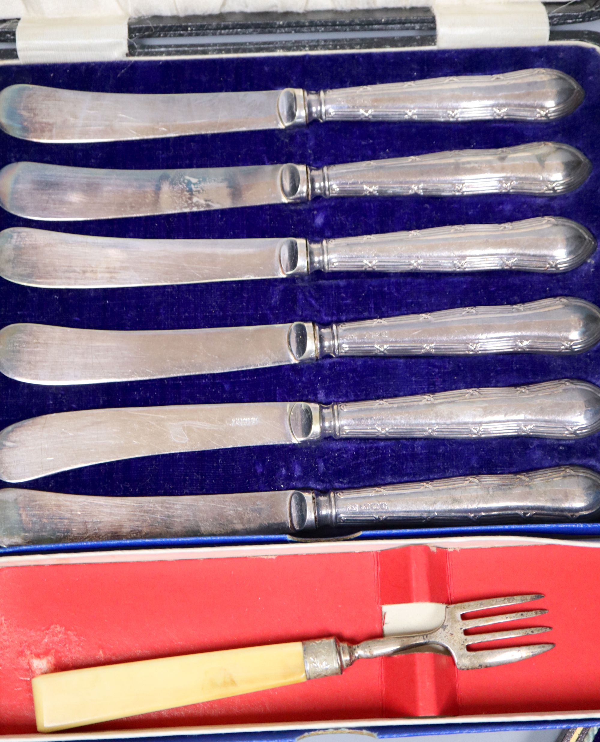 Small silver - 2 berry spoons, butter knife, ladle, feeder, christening spoon and fork. Two cased sets, tongs and a silver gilt spoon